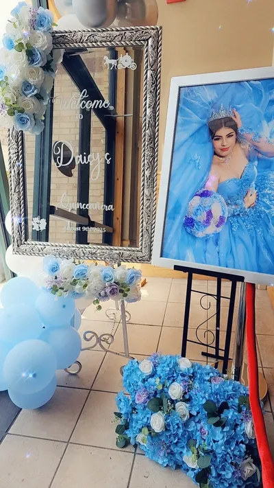 Personalized welcome mirror sign and balloon decor for a Cinderella-themed Quinceañera at Elks Lodge in Blue Springs Missouri
