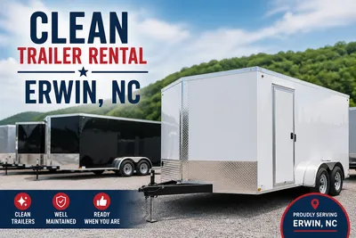 Clean trailer rental in Erwin, NC featuring a white enclosed trailer and a lineup of maintained rental trailers