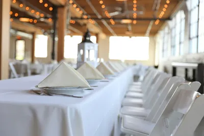 Event seating layout showing tables and chairs arranged for 100 guests