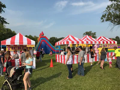 Large interactive inflatable obstacle course setup for a summer event in Topeka, KS.