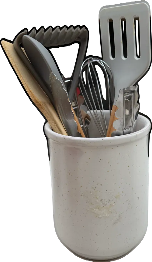 Gray tone kitchen utensils in ceramic crock