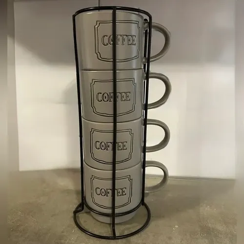 gray coffee cup set in black metal holder