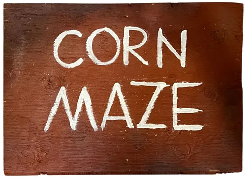 Brown Corn Maze Sign On Wood