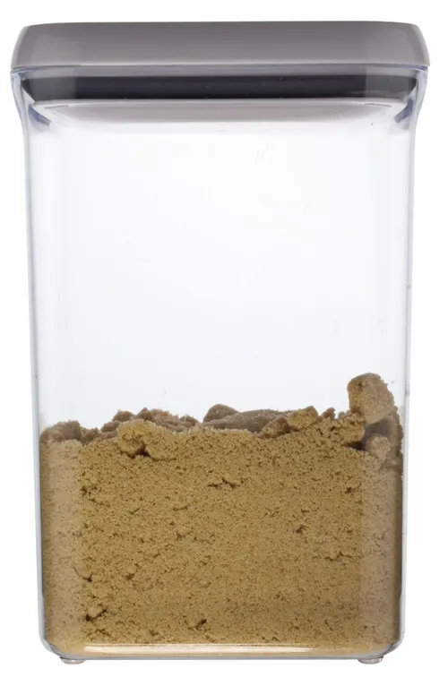 Clear Tall Rectangular Pop Top Storage Container With White Lid Containing Brown Sugar