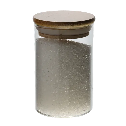 Clear Glass Canister With Bamboo Lid Containing White Baking Sprinkles