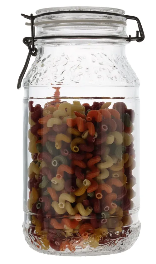 Clear Floral Glass Canister With Hinged Lid Containing Pasta