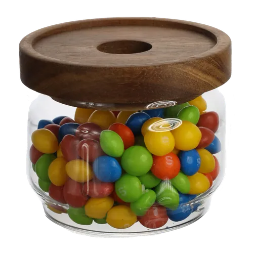 Clear Glass Jar With Walnut Lid Containing Candy