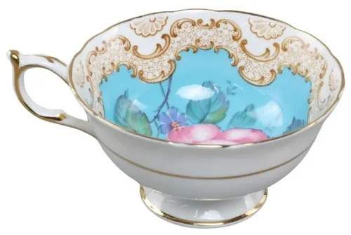 White & Gold Porcelain Teacup With Rose Interior