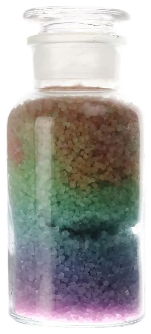 Clear Glass Bottle Containing Rainbow Bath Crystals