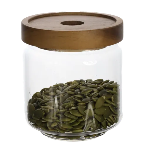 Clear Glass Canister With Walnut Lid Containing Pumpkin Seeds