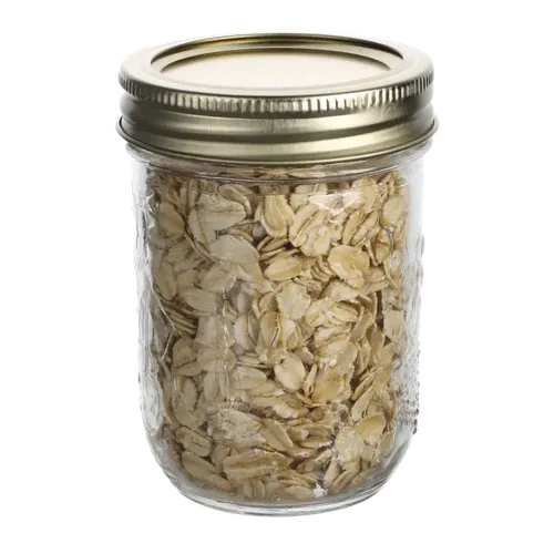 Small Clear Mason Jar With Tin Lid Containing Oats