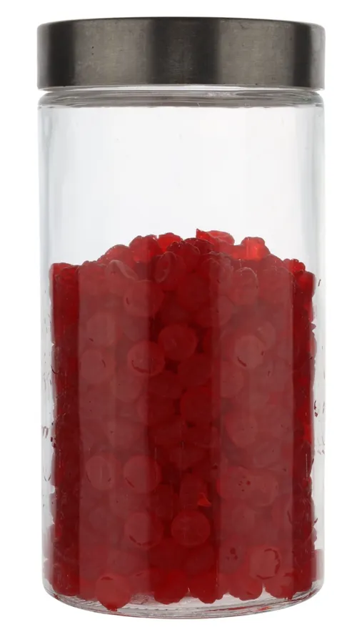 Clear Glass Canister With Silver Lid Containing Red Candy