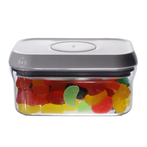 Clear Rectangular Pop Top Storage Container With White Lid Containing Jujubes