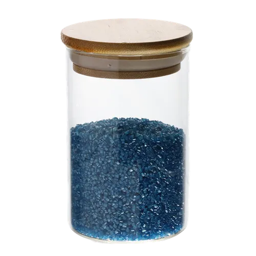 Clear Glass Canister With Bamboo Lid Containing Blue Baking Sprinkles
