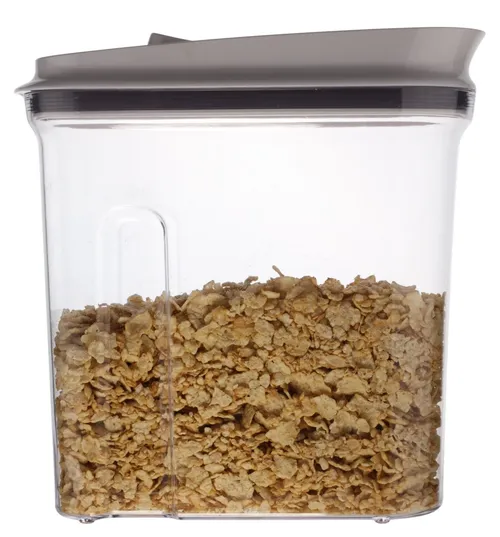 Clear Plastic Container With White Lid Containing Flaked Cereal