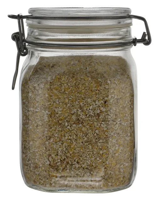 Clear Glass Canister With Hinged Lid Containing Cornmeal