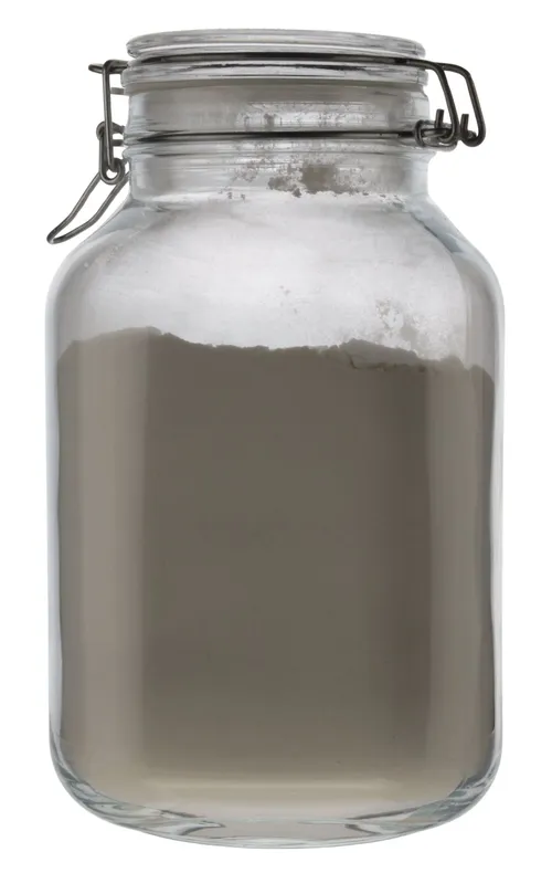 Clear Glass Canister With Hinged Lid Containing Flour