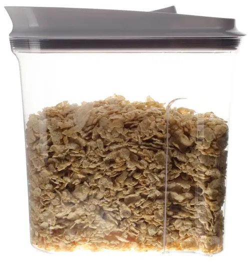 Clear Plastic Container With White Lid Containing Cereal Flakes