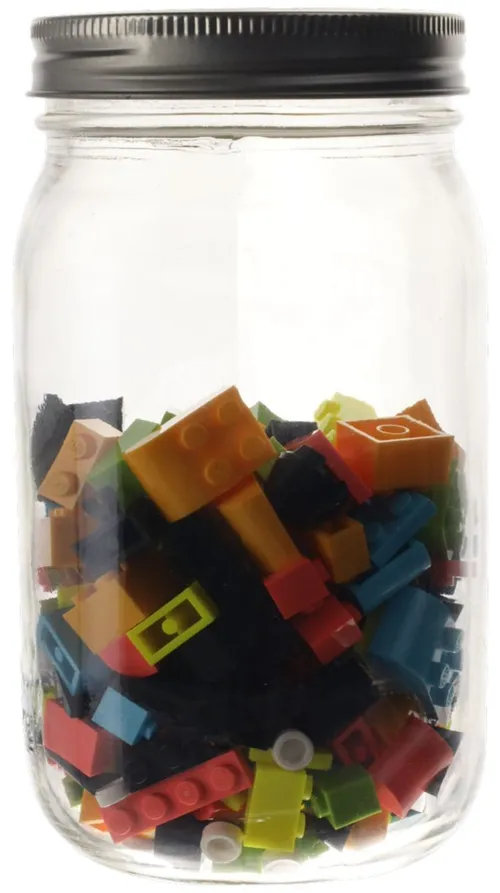 Clear Glass Jar Containing Building Blocks