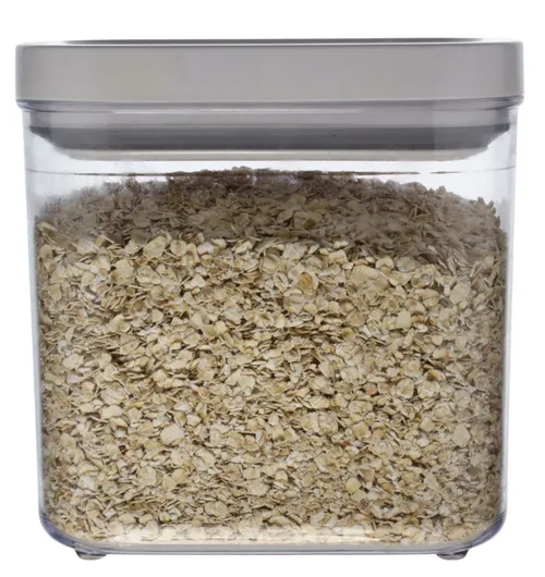 Clear Rectangular Pop Top Storage Container With White Lid Containing Oats