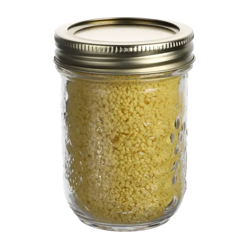 Small Clear Mason Jar With Tin Lid Containing Couscous