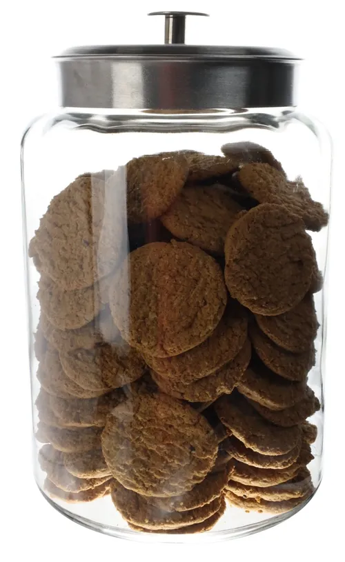 Large Clear Glass Canister With Silver Lid Containing Cookies