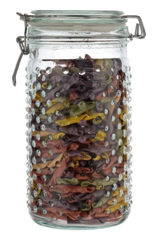Clear Dotted Glass Canister With Clamp Lid Containing Colourful Pasta