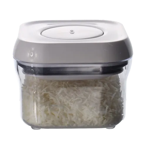 Clear Square Pop Top Storage Container With White Lid Containing Shredded Coconut