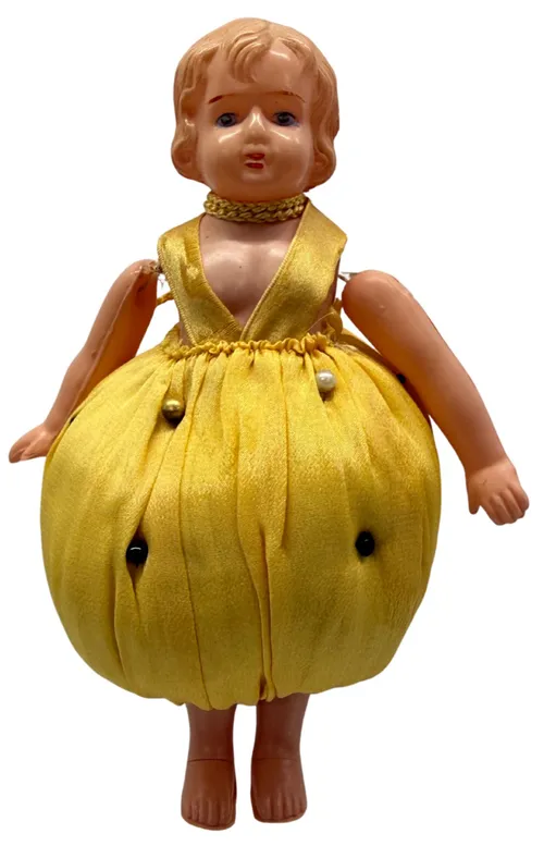 Antique Celluloid Doll With Yellow Pincushion Dress