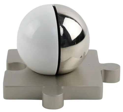 White & Chrome Orb Container On Silver Metal Puzzle Piece