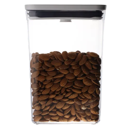 Clear Rectangular Pop Top Low Profile Storage Container With White Lid Containing Walnuts
