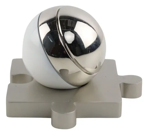 White & Chrome Orb Paper Clip Container On Silver Metal Puzzle Piece