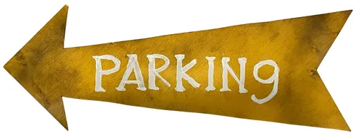 Yellow Parking Arrow Sign On Wood
