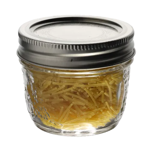 Clear Glass Jar With Silver Lid Containing Pasta Noodles