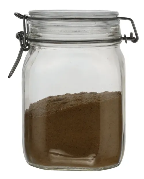 Clear Glass Canister With Hinged Lid Containing Cocoa 