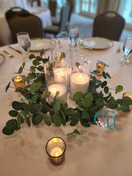 Glass and Candle Centerpiece with greenery