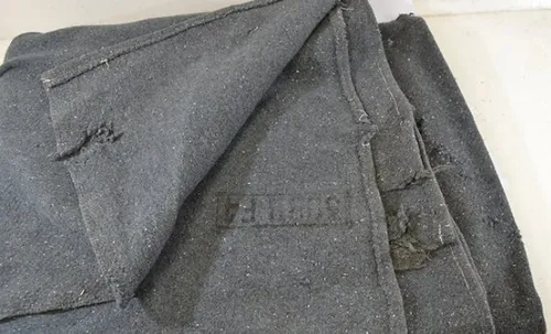 Large worn grey blanket