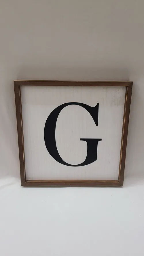 White Framed G Sign
