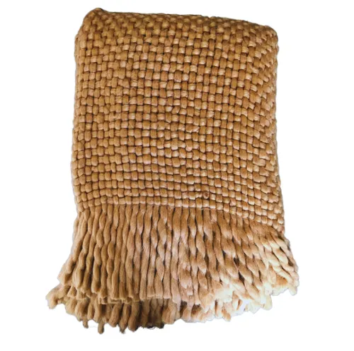 Rust knit tassel throw 