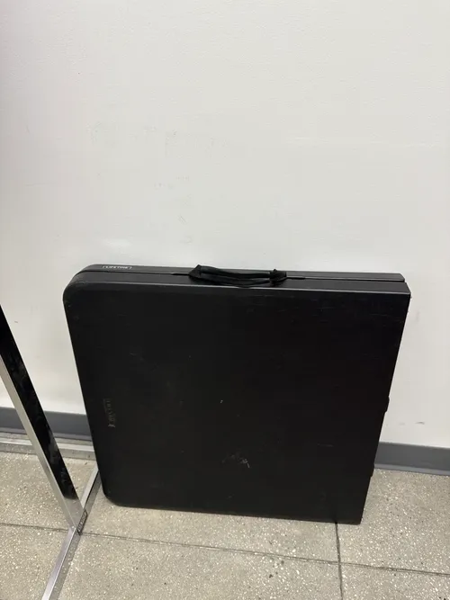 Black folding table (4' L x 2' W)