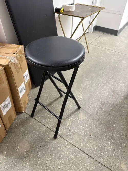 Collapsable black metal stool