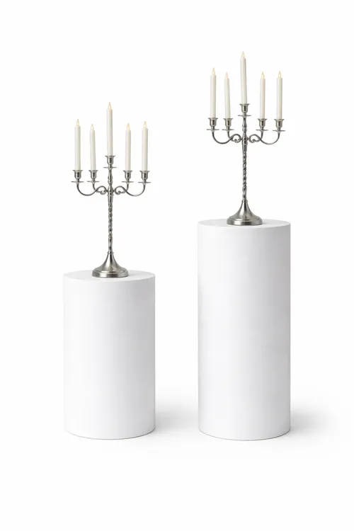 Silver Candelabras on White Pedestals