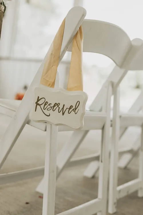 SIGN: reserved hanging white and gold ribbon