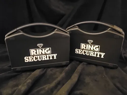 RING BEARER: black ring security boxes with glasses and ear piece