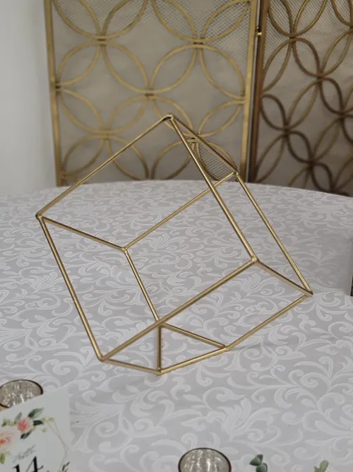 CENTERPIECE: Gold metal cubes. 