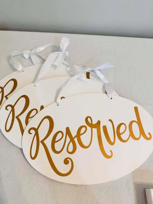 Reserved sign gold and white