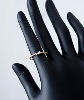 Gold Ring with Small White Gemstones