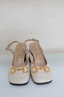 Cream Gucci Mules with Gold Buckles