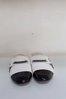 Chanel Black and White Mules with Chain