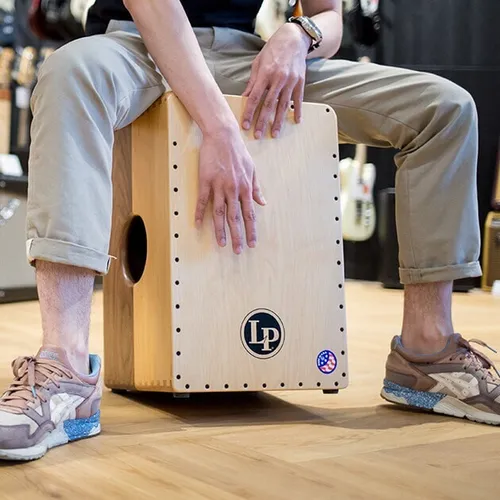 Cajon drum in black case
